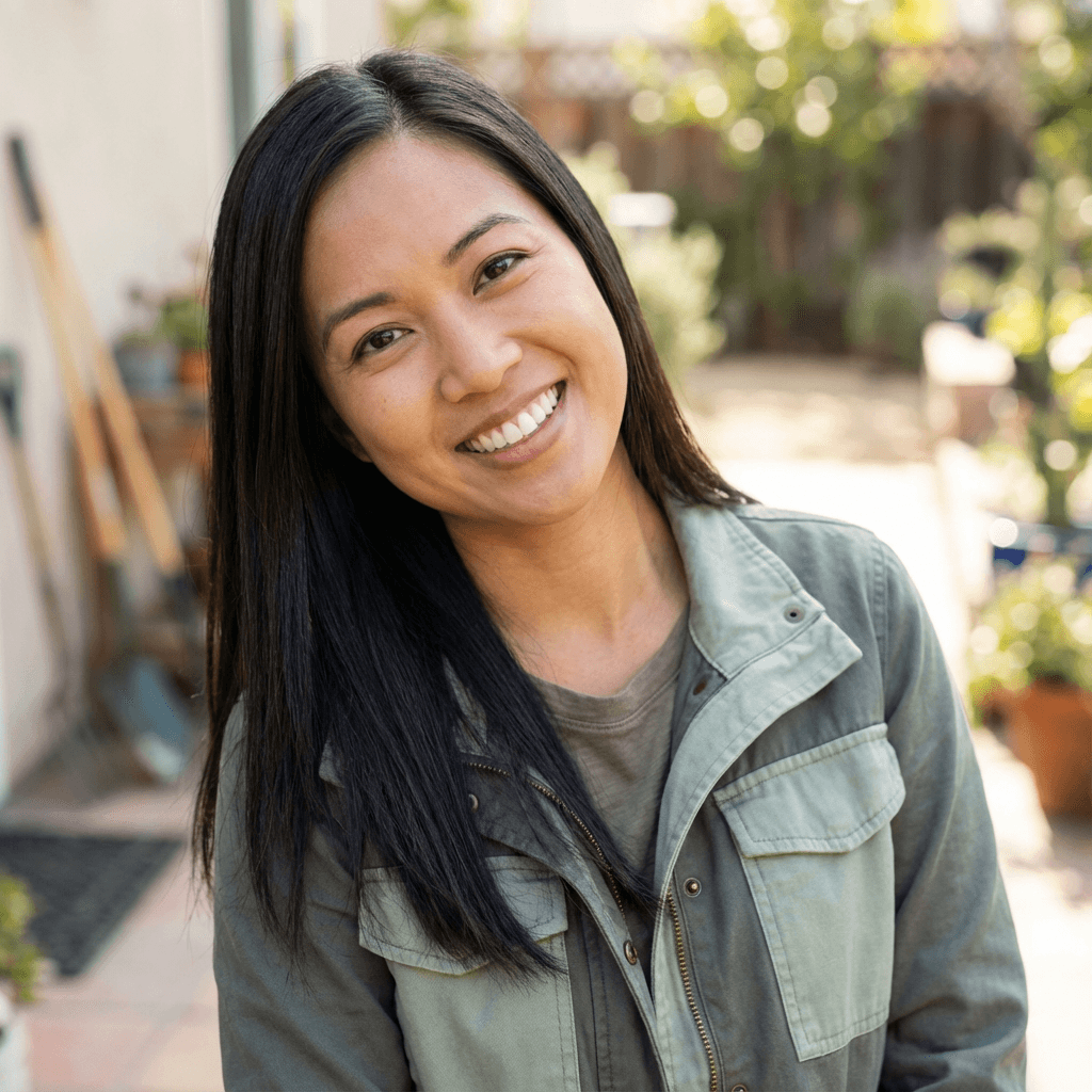 Margaret Chen standing on a well-maintained front lawn outside her Toronto home